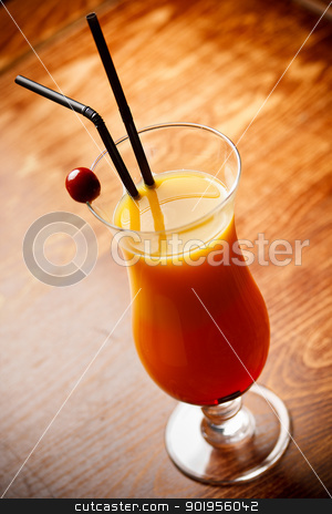 Cocktail with orange Juice Cocktail with orange Juice stock photo, Cocktail with orange Juice on bar tabel, cherry and straw decoration by Grafvision