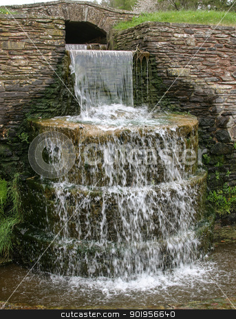 To use this stock image in your creative project, please select the size you need over to the right and click the "Add to Cart" button.
Your downloaded image will come with the Cutcaster watermark removed so don’t worry about the watermark you see on this page. Stone Circular Waterfall stock photo, A decorative Stone Circular Waterfall. by Trevor Jordan