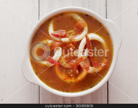 To use this stock image in your creative project, please select the size you need over to the right and click the "Add to Cart" button.
Your downloaded image will come with the Cutcaster watermark removed so don’t worry about the watermark you see on this page. calamari seafood soup stock photo, close up of a bowl of calamari seafood soup by zkruger