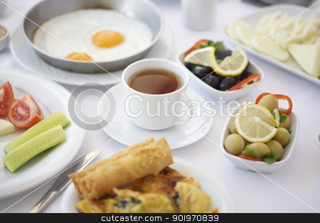 To use this stock image in your creative project, please select the size you need over to the right and click the "Add to Cart" button.
Your downloaded image will come with the Cutcaster watermark removed so don’t worry about the watermark you see on this page. A cup of tea on breakfast table stock photo, A cup of tea on breakfast table with tomatoes, cucumber, cheeses and olives by necati turker