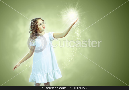 Child with magic light Child with magic light stock photo, Little girl with magic lights and shining around by Sergey Nivens