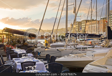 To use this stock image in your creative project, please select the size you need over to the right and click the "Add to Cart" button.
Your downloaded image will come with the Cutcaster watermark removed so don’t worry about the watermark you see on this page. Naples at sunset stock photo, Beautiful restaurant in the port of Naples at sunset, Italy by Alexey Popov