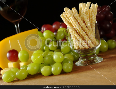 To use this stock image in your creative project, please select the size you need over to the right and click the "Add to Cart" button.
Your downloaded image will come with the Cutcaster watermark removed so don’t worry about the watermark you see on this page. Sesame Sticks with Cheese and Grapes stock photo, Snack: Sesame sticks with white grapes, some red grapes, cheese and red wine in glass in the background on wooden board (Selective Focus, Focus on the sesame sticks) by Ildiko Papp