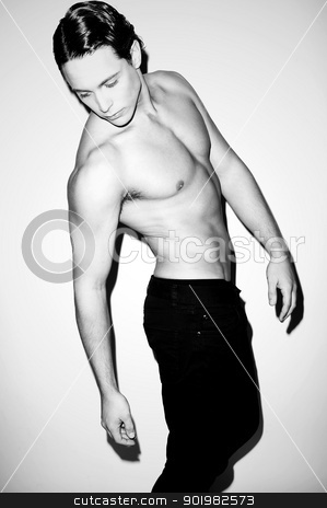 Portrait of a hunky muscular shirtless male model Portrait of a hunky muscular shirtless male model stock photo, Black and white portrait of a hunky muscular shirtless male model indoors by Ishay Botbol