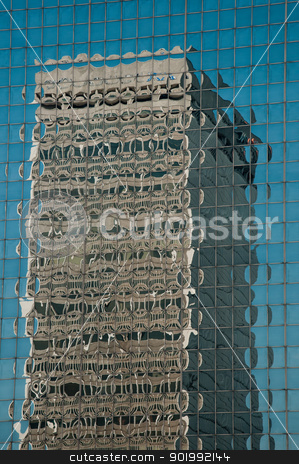 To use this stock image in your creative project, please select the size you need over to the right and click the "Add to Cart" button.
Your downloaded image will come with the Cutcaster watermark removed so don’t worry about the watermark you see on this page. Reflection of a Building stock photo, A skyscraper's image is reflected in the windows of another building. by Joe Tabb