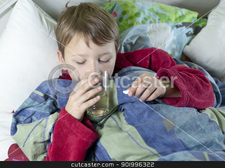 To use this stock image in your creative project, please select the size you need over to the right and click the "Add to Cart" button.
Your downloaded image will come with the Cutcaster watermark removed so don’t worry about the watermark you see on this page. Young boy in bed taking his medicin stock photo, Young caucasian boy in bed with the flu taking his medicin by Johan Lenell