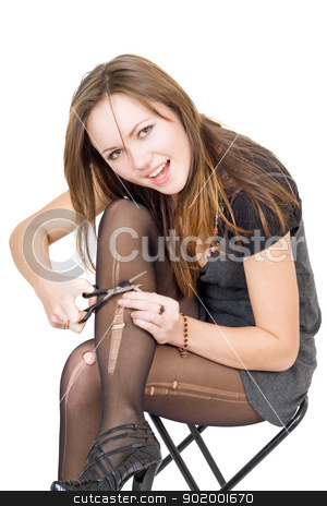 Girl with scissors cuts the stockings. Isolated Girl with scissors cuts the stockings. Isolated stock photo, Girl with scissors cuts the stockings. Isolated by Sergii Sukhorukov