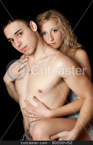 Attractive loving young couple. Isolated Attractive loving young couple. Isolated stock photo, Attractive loving young couple. Isolated on black by Sergii Sukhorukov