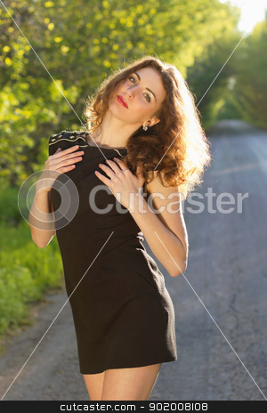 Portrait of a nice young woman Portrait of a nice young woman stock photo, Portrait of a nice young woman in black dress by Sergii Sukhorukov