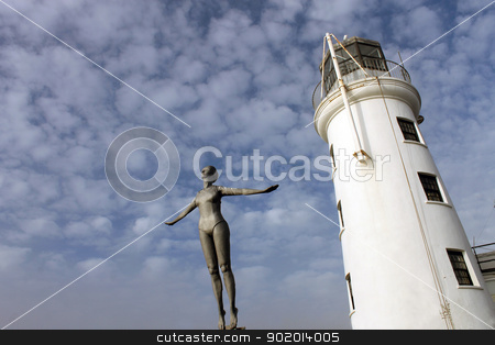 Lighthouse and diving belle statue Lighthouse and diving belle statue stock photo, Lighthouse and diving belle statue, Scarborough, England. by Martin Crowdy