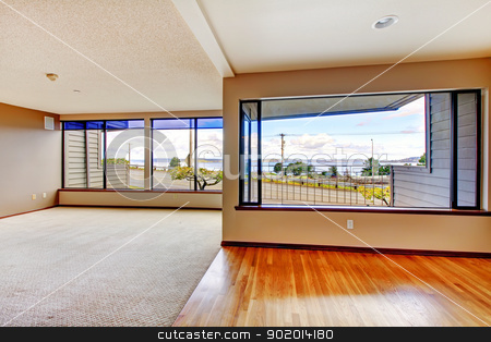 To use this stock image in your creative project, please select the size you need over to the right and click the "Add to Cart" button.
Your downloaded image will come with the Cutcaster watermark removed so don’t worry about the watermark you see on this page. Apartment living room with large windows. stock photo, Apartment living room with large windows, carpet and hardwood floor. by iriana88w