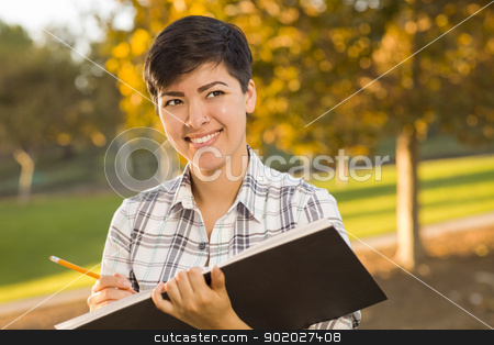 To use this stock image in your creative project, please select the size you need over to the right and click the "Add to Cart" button.
Your downloaded image will come with the Cutcaster watermark removed so don’t worry about the watermark you see on this page. Mixed Race Young Female Holding Sketch Book and Pencil Outdoors stock photo, Portrait of a Pretty Mixed Race Female Holding Sketch Book and Pencil Outdoors at the Park on a Sunny Afternoon. by Andy Dean