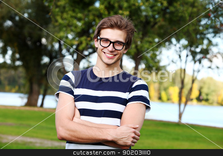 To use this stock image in your creative project, please select the size you need over to the right and click the "Add to Cart" button.
Your downloaded image will come with the Cutcaster watermark removed so don’t worry about the watermark you see on this page. Portrait of young cute man with glasses in park stock photo, Portrait of young and smiling cute man with glasses in park by yekostock