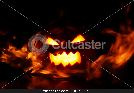 Halloween pumpkin in fire Halloween pumpkin in fire stock photo, halloween pumpkin in fire over a black background by yekostock