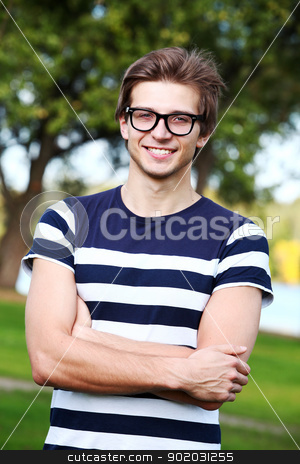 To use this stock image in your creative project, please select the size you need over to the right and click the "Add to Cart" button.
Your downloaded image will come with the Cutcaster watermark removed so don’t worry about the watermark you see on this page. Portrait of young cute man with glasses in park stock photo, Portrait of young and smiling cute man with glasses in park by yekostock