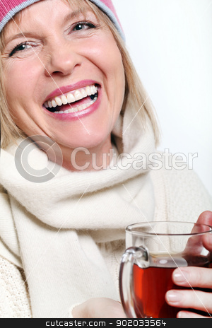 Mid age Woman With Hot tea Wearing Winter Clothes Mid age Woman With Hot tea Wearing Winter Clothes stock photo, Mid age Woman With Hot tea Wearing Winter Clothes on a white background by yekostock