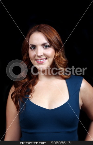To use this stock image in your creative project, please select the size you need over to the right and click the "Add to Cart" button.
Your downloaded image will come with the Cutcaster watermark removed so don’t worry about the watermark you see on this page. Woman Red Hair stock photo, Red hair woman with blue dress in front of dark background. by Henrik Lehnerer