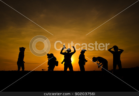 To use this stock image in your creative project, please select the size you need over to the right and click the "Add to Cart" button.
Your downloaded image will come with the Cutcaster watermark removed so don’t worry about the watermark you see on this page. silhouette photographer. stock photo, silhouette of friends photographer in sunset. by chatchai