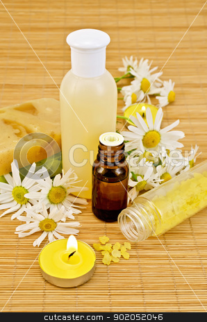 To use this stock image in your creative project, please select the size you need over to the right and click the "Add to Cart" button.
Your downloaded image will come with the Cutcaster watermark removed so don’t worry about the watermark you see on this page. Oil with yellow soap and salt stock photo, Oil in a bottle, the lotion in a plastic bottle, two homemade soaps, bath salts, two candles with flames and chamomile flowers on a bamboo mat by rezkrr