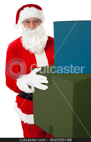 Photo of kind Santa Claus giving xmas presents Photo of kind Santa Claus giving xmas presents stock photo, Photo of kind Santa Claus giving xmas presents and looking at camera by Ishay Botbol
