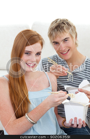 To use this stock image in your creative project, please select the size you need over to the right and click the "Add to Cart" button.
Your downloaded image will come with the Cutcaster watermark removed so don’t worry about the watermark you see on this page. Couple of friends eating pasta stock photo, Couple of friends eating pasta at home on the sofa by Wavebreak Media