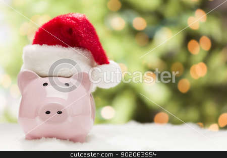 To use this stock image in your creative project, please select the size you need over to the right and click the "Add to Cart" button.
Your downloaded image will come with the Cutcaster watermark removed so don’t worry about the watermark you see on this page. Pink Piggy Bank with Santa Hat on Snowflakes stock photo, Pink Piggy Bank Wearing Red and White Santa Hat on Snowflakes with Abstract Green and Golden Background - Room for Your Own Text. by Andy Dean