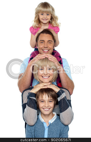 Attractive smiling family of four posing in a single line Attractive smiling family of four posing in a single line stock photo, Attractive smiling family of four posing in a single line isolated over white background. by Ishay Botbol
