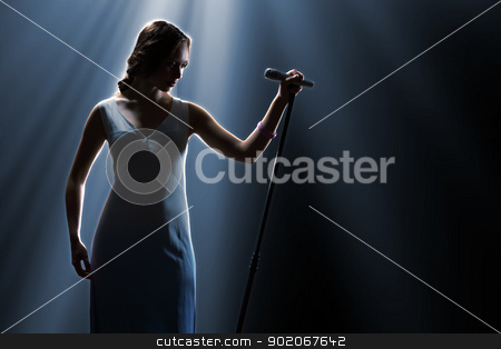To use this stock image in your creative project, please select the size you need over to the right and click the "Add to Cart" button.
Your downloaded image will come with the Cutcaster watermark removed so don’t worry about the watermark you see on this page. Female singer on the stage stock photo, Female singer on the stage holding a microphone by Sergey Nivens