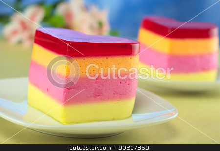 To use this stock image in your creative project, please select the size you need over to the right and click the "Add to Cart" button.
Your downloaded image will come with the Cutcaster watermark removed so don’t worry about the watermark you see on this page. Peruvian Jelly Cake stock photo, Colorful Peruvian heart-shaped jelly-pudding cakes called Torta Helada with inca lily in the back (Selective Focus, Focus on the front of the first cake) by Ildiko Papp