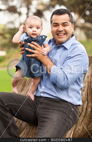 Handsome Hispanic Father and Son Posing for A Portrait Handsome Hispanic Father and Son Posing for A Portrait stock photo, Handsome Hispanic Father and Son Posing for A Portrait in the Park. by Andy Dean