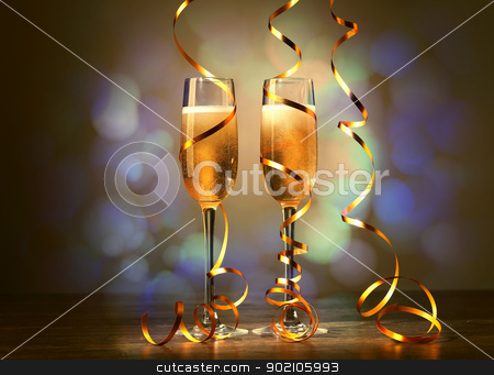 Glasses of champagne at new year party Glasses of champagne at new year party stock photo, Two champagne glasses ready to bring in the New Year by Sergey Nivens