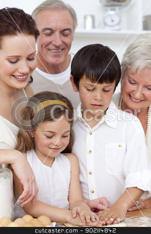 To use this stock image in your creative project, please select the size you need over to the right and click the "Add to Cart" button.
Your downloaded image will come with the Cutcaster watermark removed so don’t worry about the watermark you see on this page. Grandparents looking at children baking in the kitchen stock photo, Grandparents looking at boy and a little girl baking in the kitchen by Wavebreak Media