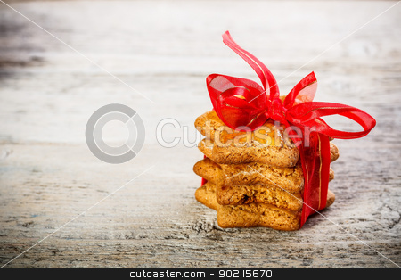 To use this stock image in your creative project, please select the size you need over to the right and click the "Add to Cart" button.
Your downloaded image will come with the Cutcaster watermark removed so don’t worry about the watermark you see on this page. Gingerbread cookies stock photo, Christmas gingerbread cookies tied with red ribbon by Grafvision