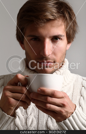 To use this stock image in your creative project, please select the size you need over to the right and click the "Add to Cart" button.
Your downloaded image will come with the Cutcaster watermark removed so don’t worry about the watermark you see on this page. Handsome man in sweater drinking tea stock photo, Handsome and beautiful man in white sweater drinking tea by yekostock