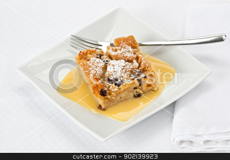 To use this stock image in your creative project, please select the size you need over to the right and click the "Add to Cart" button.
Your downloaded image will come with the Cutcaster watermark removed so don’t worry about the watermark you see on this page. Bread Pudding stock photo, Bread pudding with bourbon sauce on a square plate with fork. by Glenn Price