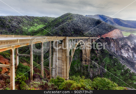 To use this stock image in your creative project, please select the size you need over to the right and click the "Add to Cart" button.
Your downloaded image will come with the Cutcaster watermark removed so don’t worry about the watermark you see on this page. Bixby Bridge stock photo, Famous Bixby Bridge in Big Sur, California. by Ken Wolter
