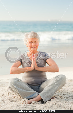 To use this stock image in your creative project, please select the size you need over to the right and click the "Add to Cart" button.
Your downloaded image will come with the Cutcaster watermark removed so don’t worry about the watermark you see on this page. Senior woman practicing yoga on the beach stock photo, Senior woman practicing yoga on the beach by Wavebreak Media