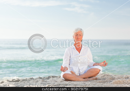 To use this stock image in your creative project, please select the size you need over to the right and click the "Add to Cart" button.
Your downloaded image will come with the Cutcaster watermark removed so don’t worry about the watermark you see on this page. Mature woman practicing yoga on the beach stock photo, Mature woman practicing yoga on the beach by Wavebreak Media
