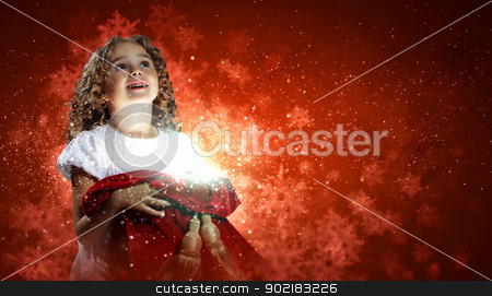 Happy girl opening gift box Happy girl opening gift box stock photo, A cute young girl holding a christmas gift, dark background with christmas light bokeh by Sergey Nivens