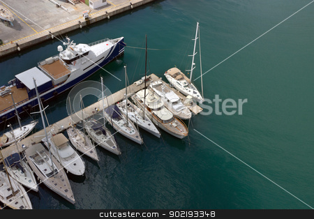 To use this stock image in your creative project, please select the size you need over to the right and click the "Add to Cart" button.
Your downloaded image will come with the Cutcaster watermark removed so don’t worry about the watermark you see on this page. sailboats stock photo, Sailboats at Port Vell, Barcelona.Spain. by Vladyslav Danilin