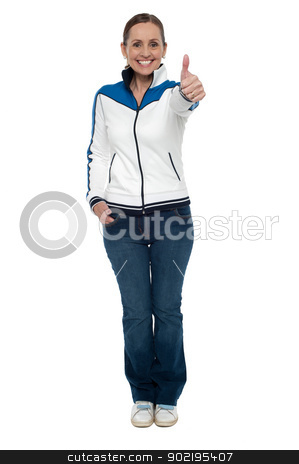 Casual charming woman gesturing thumbs up Casual charming woman gesturing thumbs up stock photo, Casual charming woman gesturing thumbs up. Full length studio shot. by Ishay Botbol