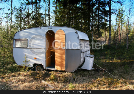 To use this stock image in your creative project, please select the size you need over to the right and click the "Add to Cart" button.
Your downloaded image will come with the Cutcaster watermark removed so don’t worry about the watermark you see on this page. Vintage caravan stock photo, Vintage caravan in the forest by Ingvar Bjork
