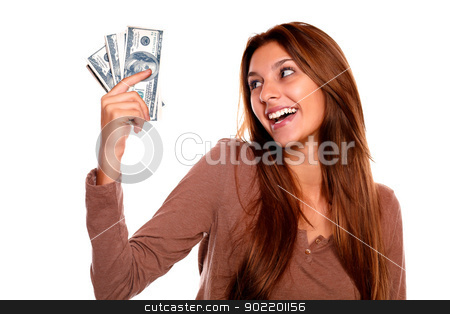 To use this stock image in your creative project, please select the size you need over to the right and click the "Add to Cart" button.
Your downloaded image will come with the Cutcaster watermark removed so don’t worry about the watermark you see on this page. Smiling young female holding up cash money stock photo, Portrait of a smiling and happy young female holding up cash money with long brown hair on white background by pablocalvog