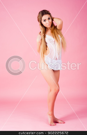 To use this stock image in your creative project, please select the size you need over to the right and click the "Add to Cart" button.
Your downloaded image will come with the Cutcaster watermark removed so don’t worry about the watermark you see on this page. Attractive woman with sexy apron stock photo, Young Sexy woman posing in white sexy apron at pink background by Aikon