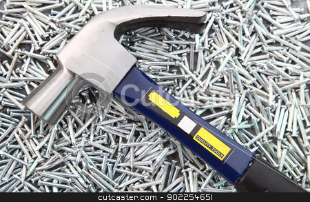 Hammer on Nails Hammer on Nails stock photo, Hammer on heap of Silver Concrete nails by Vichaya Kiatying-Angsulee