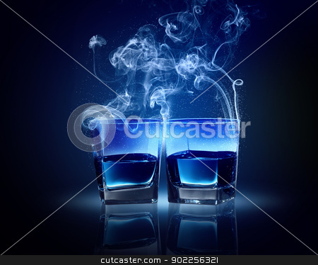 To use this stock image in your creative project, please select the size you need over to the right and click the "Add to Cart" button.
Your downloaded image will come with the Cutcaster watermark removed so don’t worry about the watermark you see on this page. Two glasses of blue cocktail stock photo, Two glasses oC0 blue cocktail with fume going out by Sergey Nivens