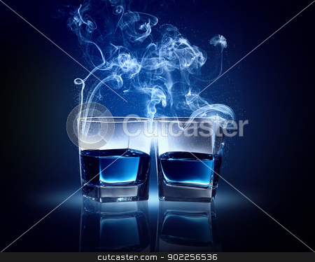 Two glasses of blue cocktail Two glasses of blue cocktail stock photo, Two glasses oC0 blue cocktail with fume going out by Sergey Nivens