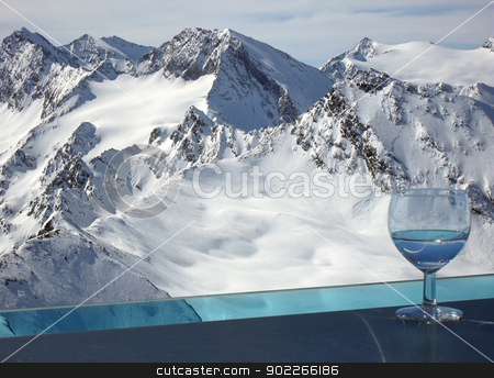 To use this stock image in your creative project, please select the size you need over to the right and click the "Add to Cart" button.
Your downloaded image will come with the Cutcaster watermark removed so don’t worry about the watermark you see on this page. Drink in Alps stock photo, Otztal Alps viewed from the balcony of the bar on the top of Tiefenbachkogl (3309 m) in the Solden ski resort (Austria) with the glass of drink standing on the external bar surrounding the balcony. by Krzysztof Nahlik
