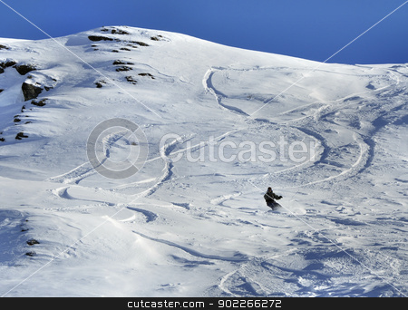 To use this stock image in your creative project, please select the size you need over to the right and click the "Add to Cart" button.
Your downloaded image will come with the Cutcaster watermark removed so don’t worry about the watermark you see on this page. Snowboarder stock photo, Snowboarder and off-piste tracks on snow in sunset light by Krzysztof Nahlik