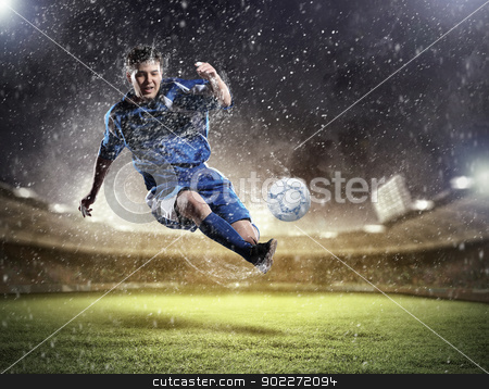 To use this stock image in your creative project, please select the size you need over to the right and click the "Add to Cart" button.
Your downloaded image will come with the Cutcaster watermark removed so don’t worry about the watermark you see on this page. football player striking the ball stock photo, football player in blue shirt striking the ball aloft at the stadium under the rain by Sergey Nivens